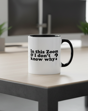 White mug with black interior and handle, featuring text on a white background