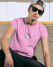 Neurofabulous T-Shirt Person wearing a pink t-shirt with a unicorn graphic and sunglasses, sitting outdoors.