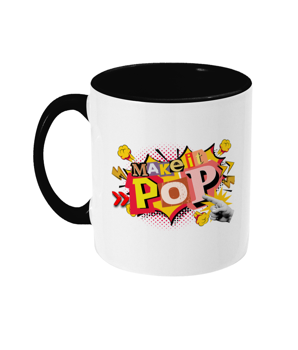 White mug with black interior and handle, featuring colorful text design on a white background