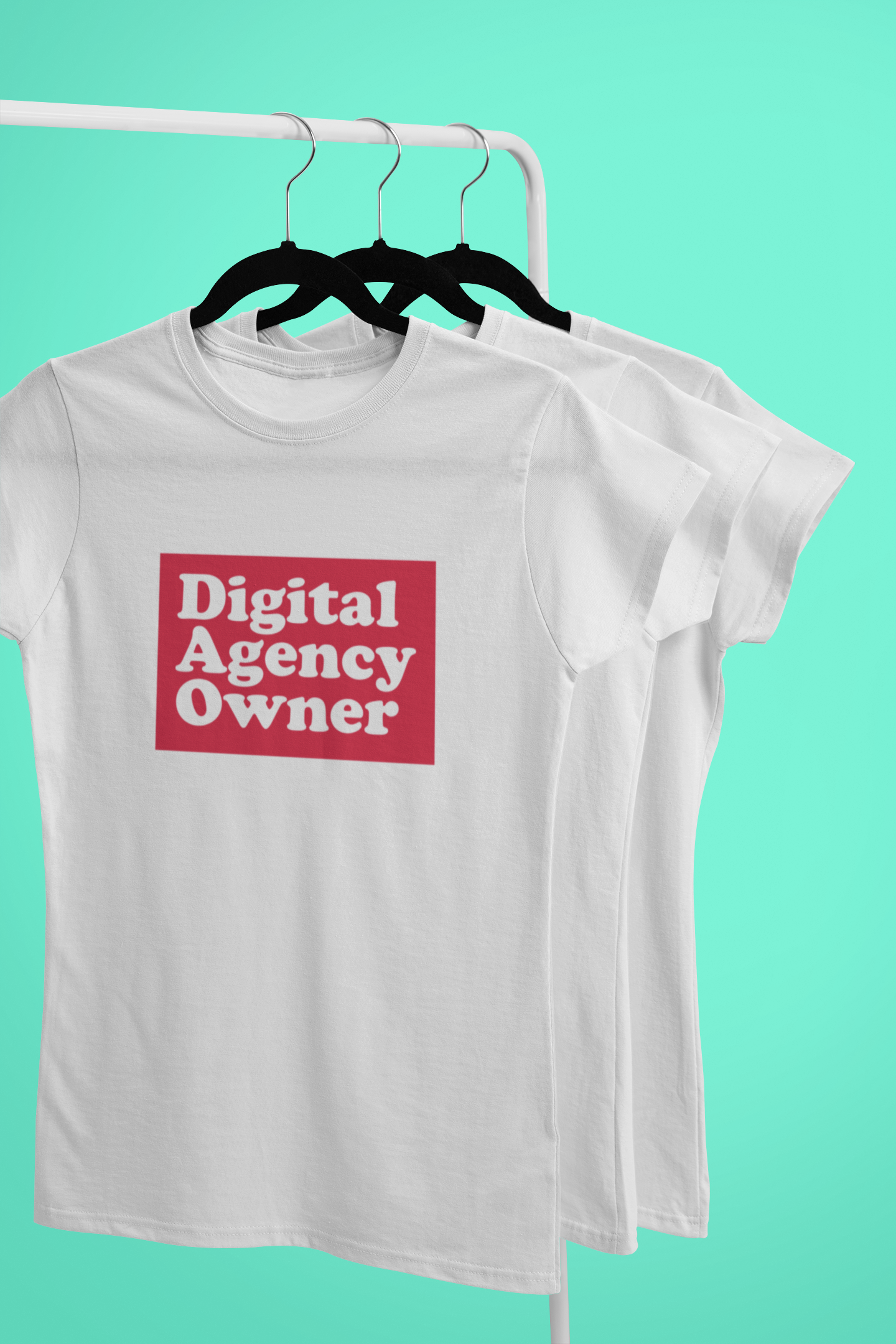 White t-shirt with 'Digital Agency Owner' text on a hanger against a teal background