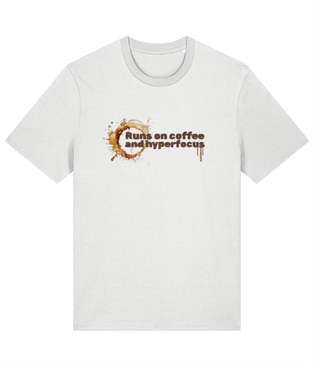 White t-shirt with text 'Runs on coffee and hyperfocus' and coffee design on a white background