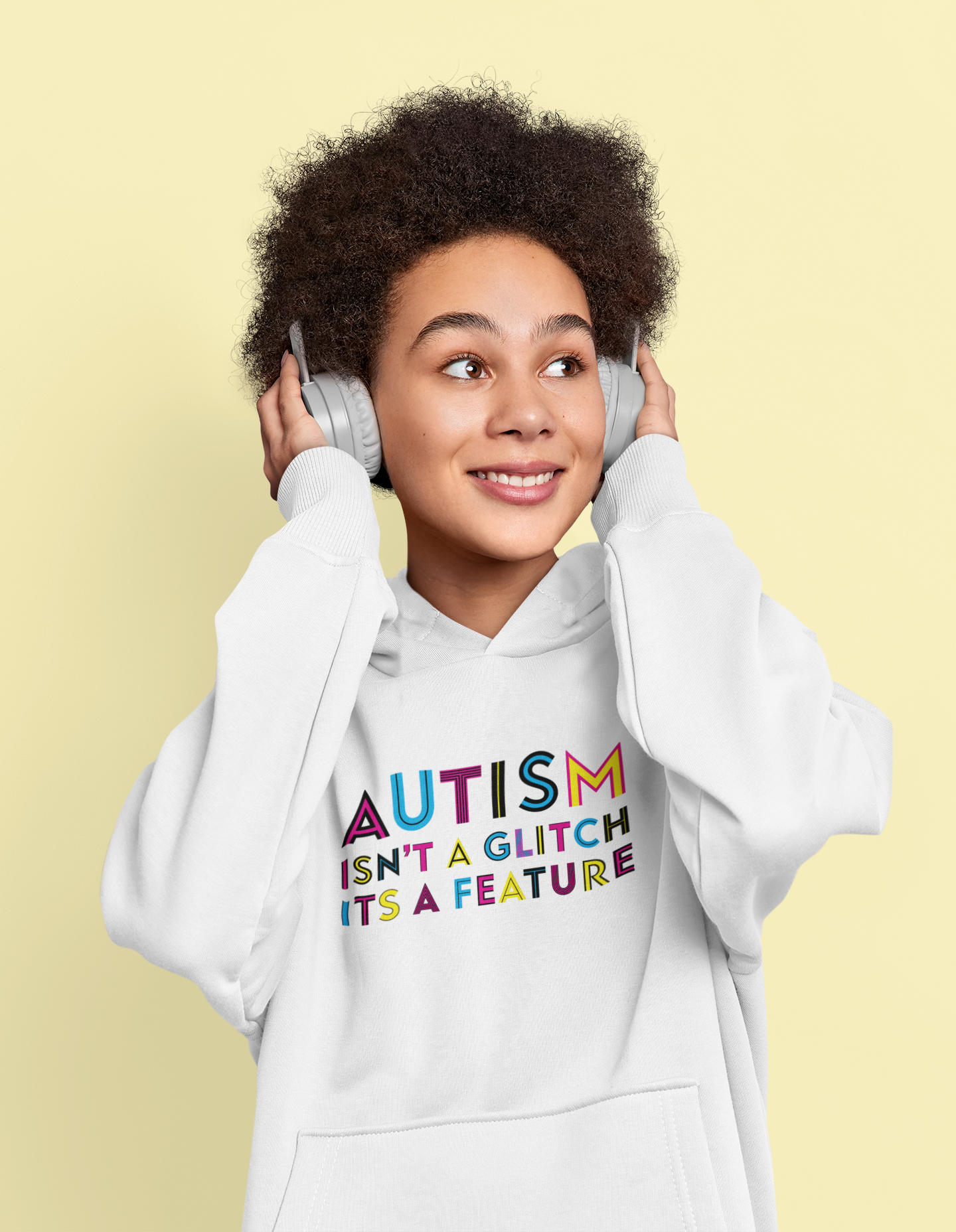 Person wearing a hoodie with 'Autism isn't a glitch, it's a feature' text on a yellow background
