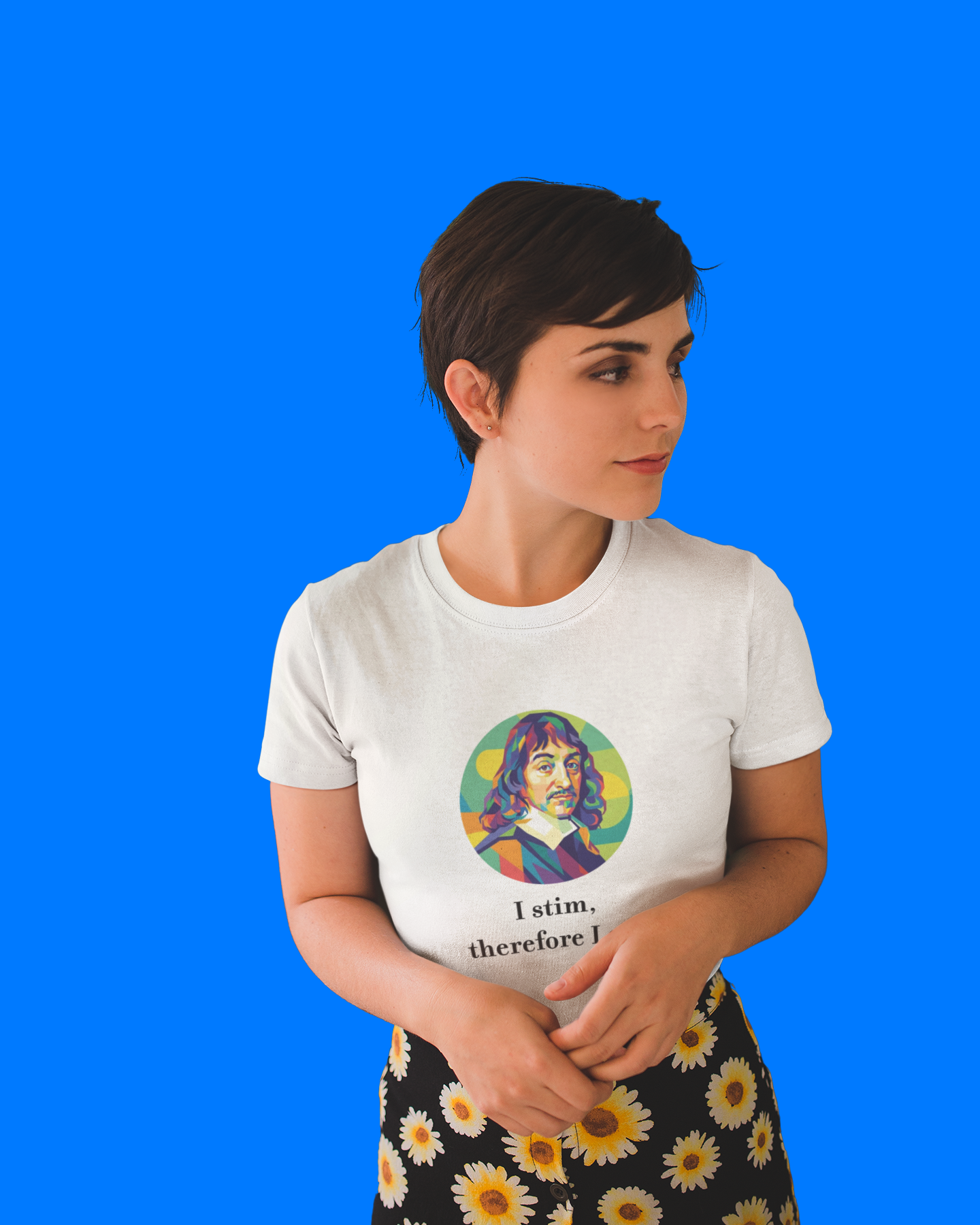 Woman wearing a white t-shirt with a colorful graphic and text on a blue background