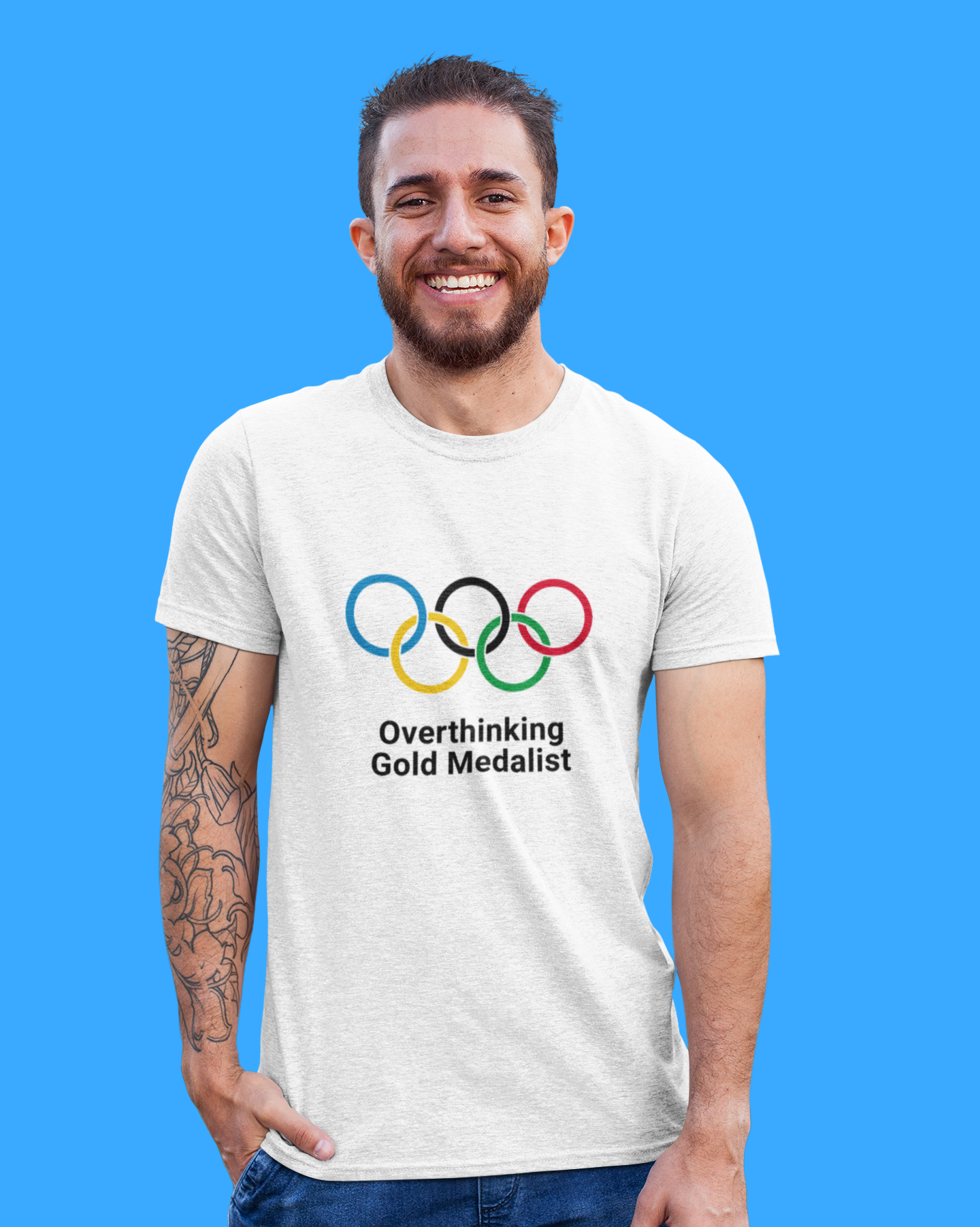 Man wearing a t-shirt with Olympic rings and text on a blue background