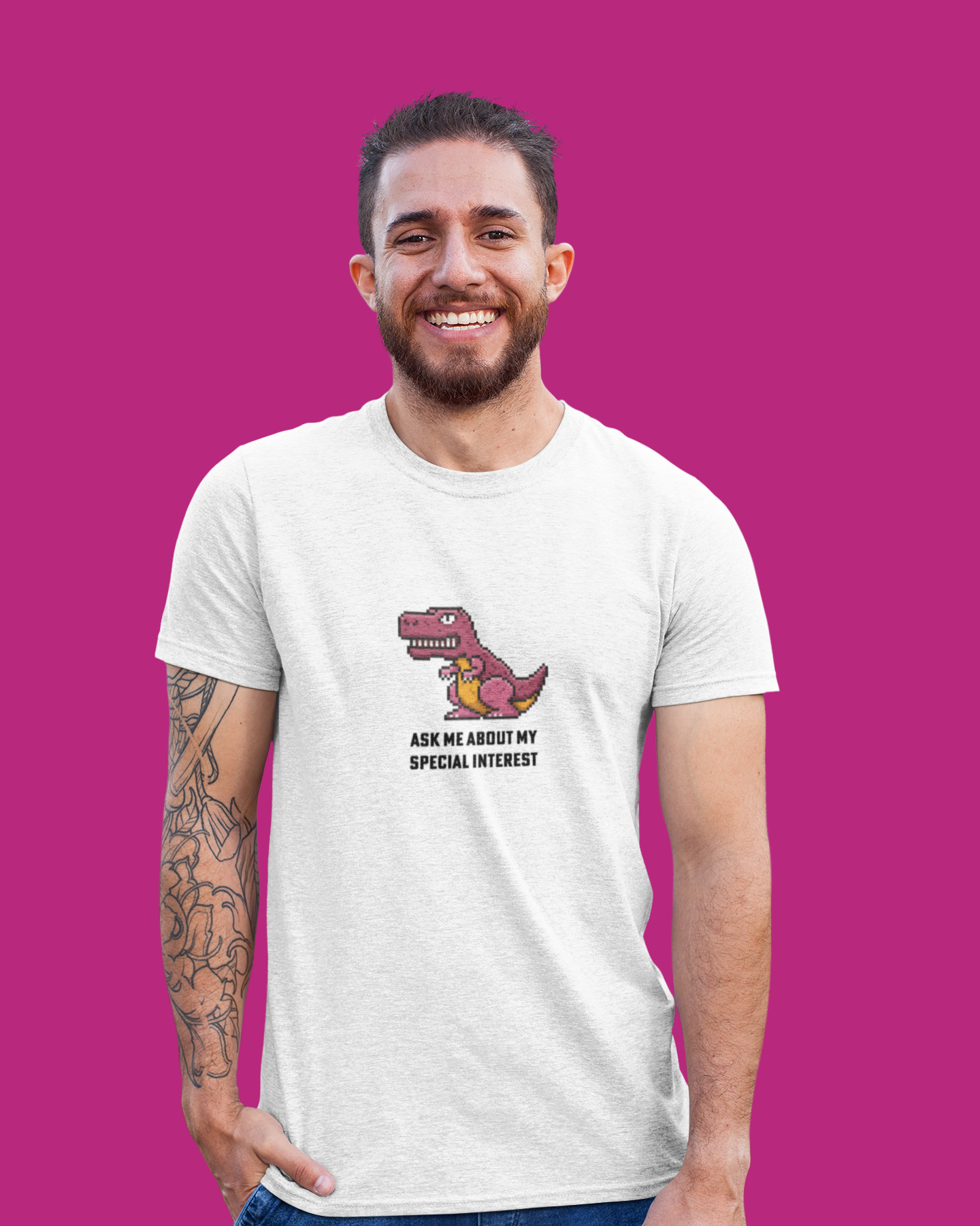 Man wearing a white t-shirt with a dinosaur graphic and text on a pink background